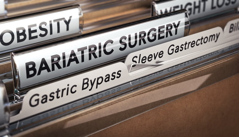 Tan folders with white tabs with “obesity,” “bariatric surgery,” “gastric bypass,” and “sleeve gastrectomy” written on them in black.