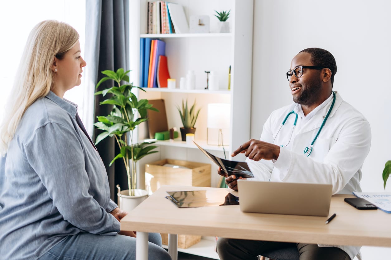 A doctor consults with a patient to help them explore their options for weight loss surgery in Alabama.